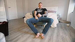 Big guy jerks off barefoot. 