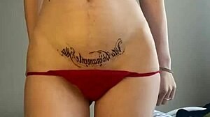 teen girl flaunts small tits getting tattoo