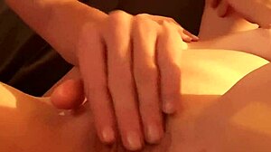 I'm fingering her shaved pussy up close while she masturbates her hairless body.