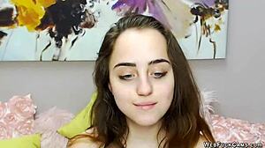 Beautiful brunette babe with small tits playing solo with vibrator on webcam