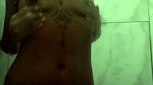 Naughty brunette shows off solo in shower!