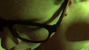 Big-tits blonde with glasses gives facial cumshot after blowjob.