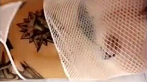 Felicity feline teases solo with her tattooed tits and brunette allure intensely