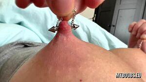 Hard nipple play with pierced milf sporting huge natural tits