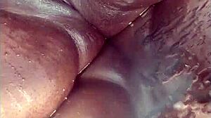 this ebony bbw amateur squirts a river during solo orgasm on bed