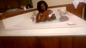 Marliese Morgan lathers up her big tits and ass provocatively!