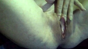 mature woman plays with glass toy