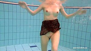 mia, the big tits brunette, strips off her bikini underwater, revealing her shaved body for a thrilling adventure.