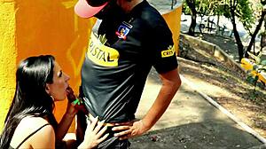 Brunette hottie sucks stranger's cock in public