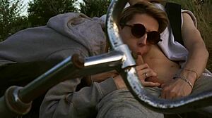 Young guy enjoys a hot blowjob during summer cycling adventure.