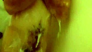 I'm pissing and playing solo in the shower for masturbation fun.