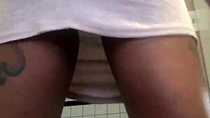 Oh wow, get an upskirt peek at her pussy in that thong and skirt!