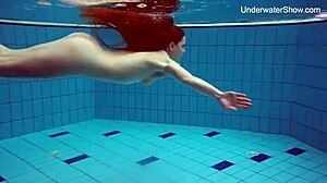 Simonna gets horny in the public pool, smoking underwater.