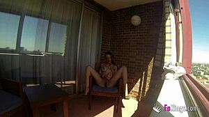 Sara Ray boldly masturbates nude on a Madrid balcony for all to see.