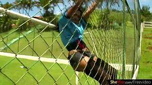 Dark-haired Latina shemale intensely strokes shecock on soccer field