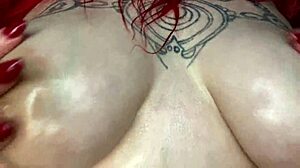 Sexy curvy bbw oils up her big tits at home