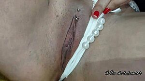 During tattoo, blonde milf receives golden shower from Mel on video call