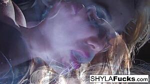 Blonde Shyla indulges in smoking fetish with big tits on display. Her solo act mesmerizes with every puff.