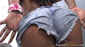 Hey, busty Kerry Louise is sucking that huge black cock at the gloryhole