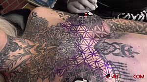 Sascha plays with Amber Luke's big tits and piercing while she masturbates with toys during tattoo!