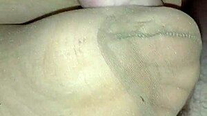Homemade footjob using various nylons, stockings, leggings, and socks on toes and feet.