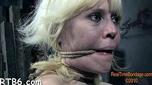 Adorable Caged Hotty Removes Glamorous Clothes In Tight Bondage Captivity