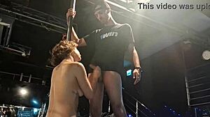 Blonde from poledance sucks big cock on stage.