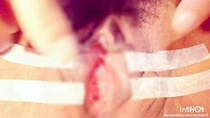 Sucking and pinching the clitoris during bondage massage with squirting orgasm