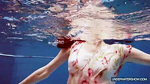 Martina, the hot Croatian teen, keeps steaming up the nudist beach. Her bikini shower show is pure fire!