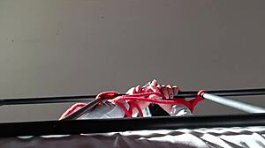 Bound in latex, she takes cock down throat