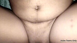 Chubby Filipina teen gives pussy to Asian boy post-blowjob.