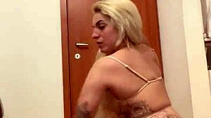 Blonde tattooed woman in erotic pose