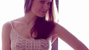 Janna kneads her big tits then fingers her pussy barefoot