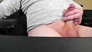 Red head lubes up cock and jerks it slowly