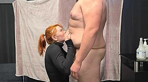 Chubby man gets belly kisses from hot redhead before blowjob and facial