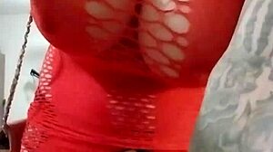 Crossdresser in fishnets has car wash fun with outdoor striptease and flashing.