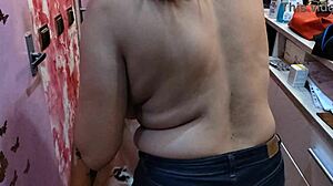 Barber babe flaunts her perfect natural tits in the shop.