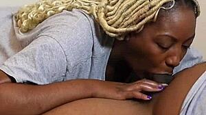 she's taking it deep down her throat, sucking that black cock with wet spit all over.