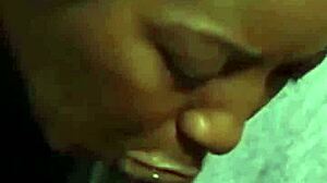 she's taking it deep down her throat, sucking that black cock with wet spit all over.