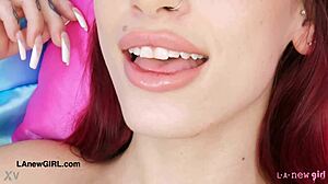 Red haired model displays her attractive figure during a photoshoot session in pov style.