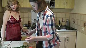 Two sexy blonde lesbians in kitchen without panties. Milf and cute girl in lingerie with perfect asses and natural tits close up.