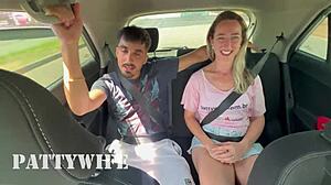 While husband drives, wife fucks big black cock in car backseat.