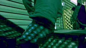 skinny girl stretches against steps at night with lattice shadows on legs