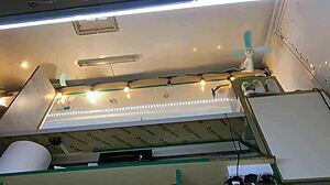 The boss is playing with his sexy shop assistant's pussy while she talks to the customer, feeling wet and horny