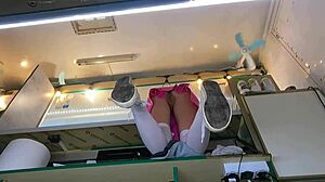 The boss is playing with his sexy shop assistant's pussy while she talks to the customer, feeling wet and horny