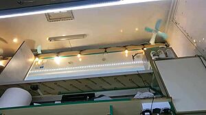 The boss is playing with his sexy shop assistant's pussy while she talks to the customer, feeling wet and horny