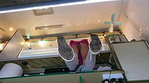 The boss is playing with his sexy shop assistant's pussy while she talks to the customer, feeling wet and horny