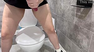 cowgirl rides fat dildo in public toilet