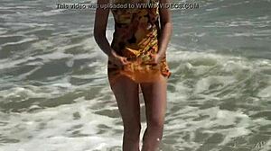 Gorgeous teen Agnes bathes her naked body in the ocean.