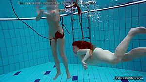 i'm one of two hot lesbians in the pool, underwater with blonde.